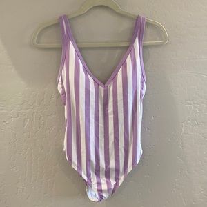Kona Sol One piece swimsuit with purple and white vertical stripes